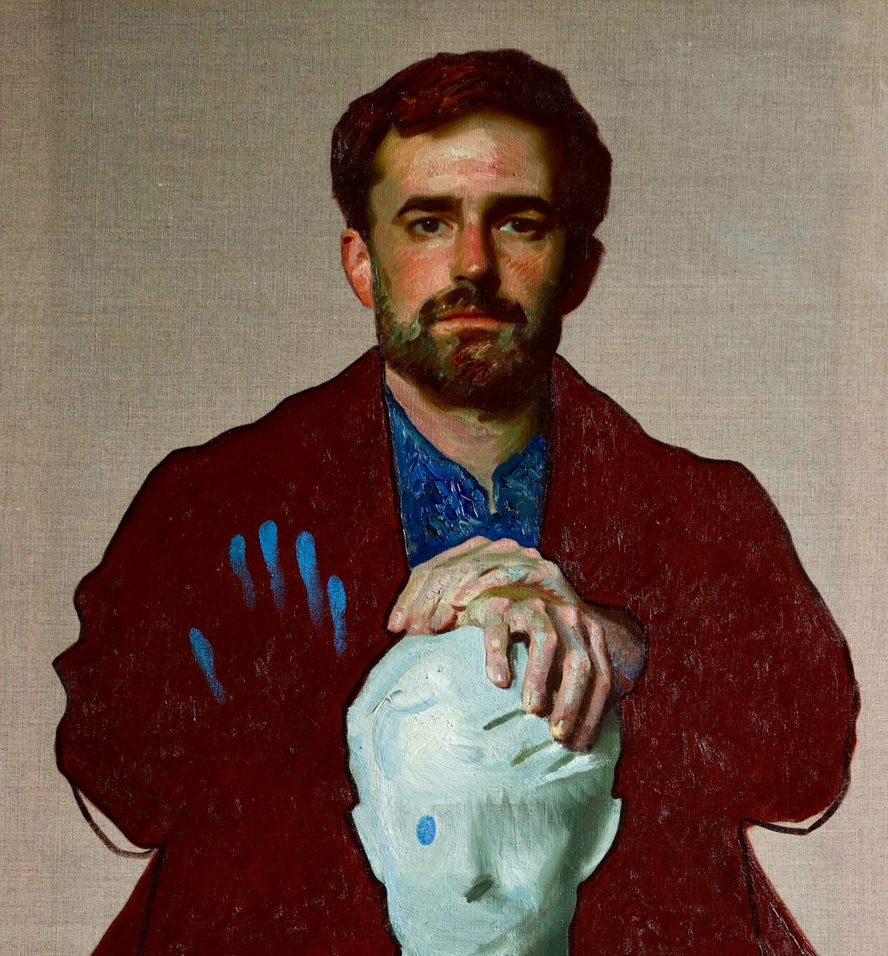 Self Portait of Jamie Coreth standing above a sculpture his dade made of him. The background is a canvas grey, Jamie is wearing what looks like a denim shirt and a dark blazer, while the sculpture is white coloured. One of the eyes seem to be blue