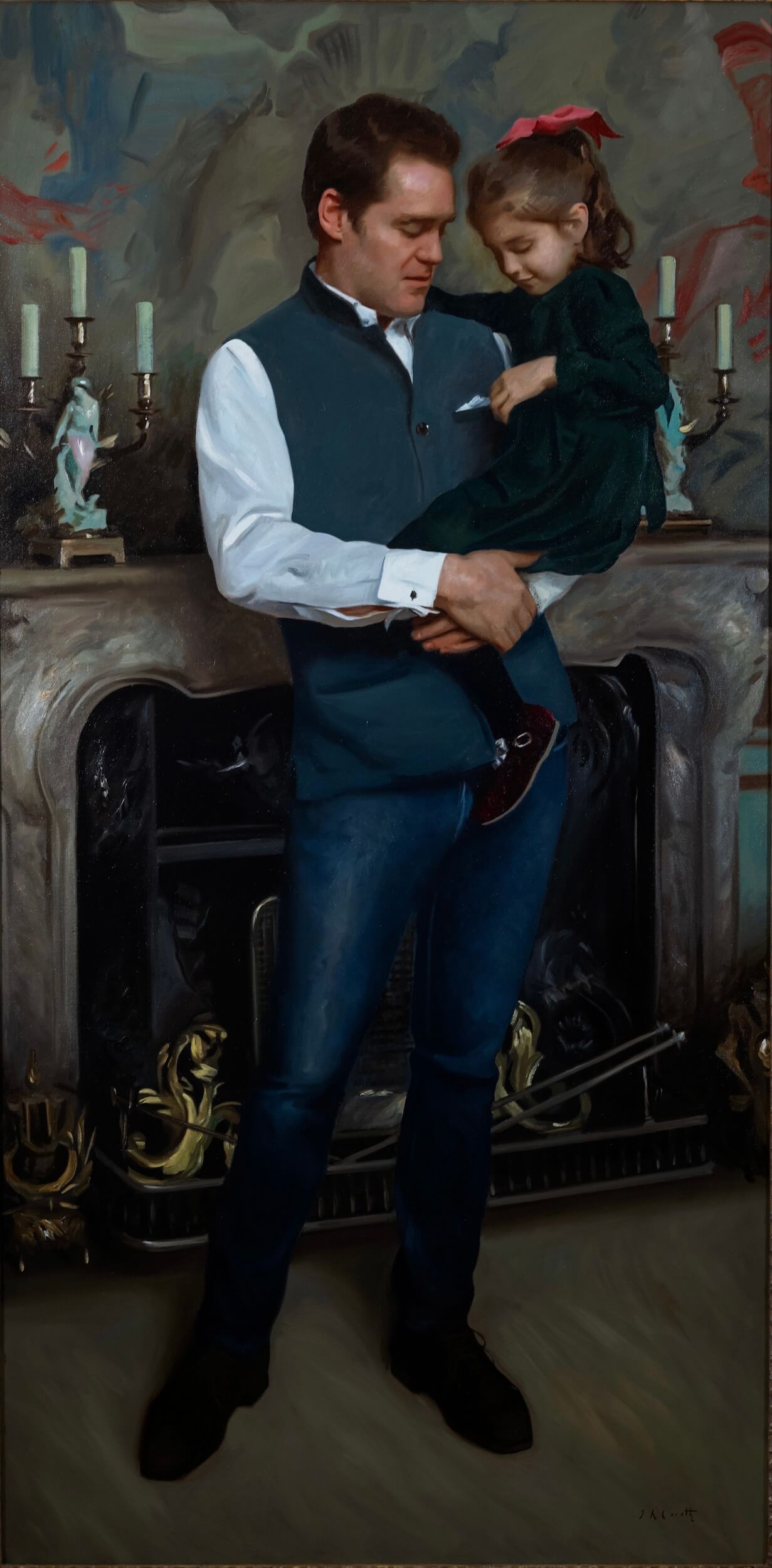 Portrait of The 11th Duke of Roxburghe and his daughter Eugenie. The man is holding his daughter lovingly, he wears a white shirt, blue gilet and blue denim jeans, while the daughter wears a black dress and a red bow in her hair. They are standing in front of a fire place which holds a few candle holders with candles in them